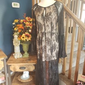 Jumper/dress, one piece.